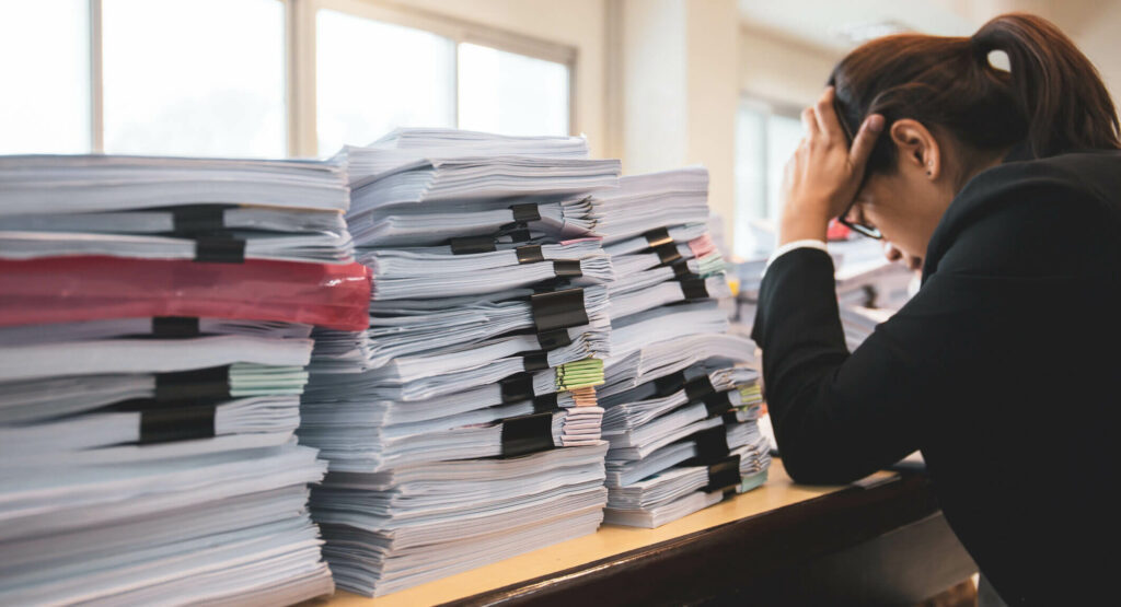 woman frustrated over the multitude of legal documents