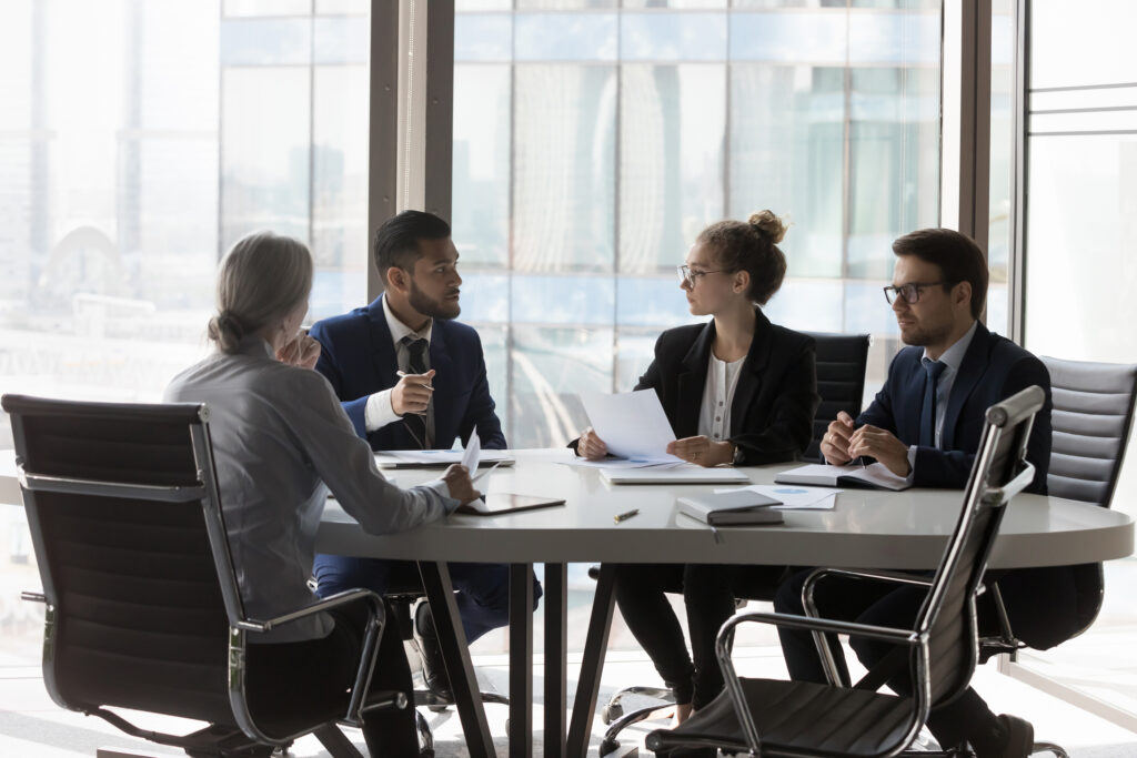 header image of lawyers around a table