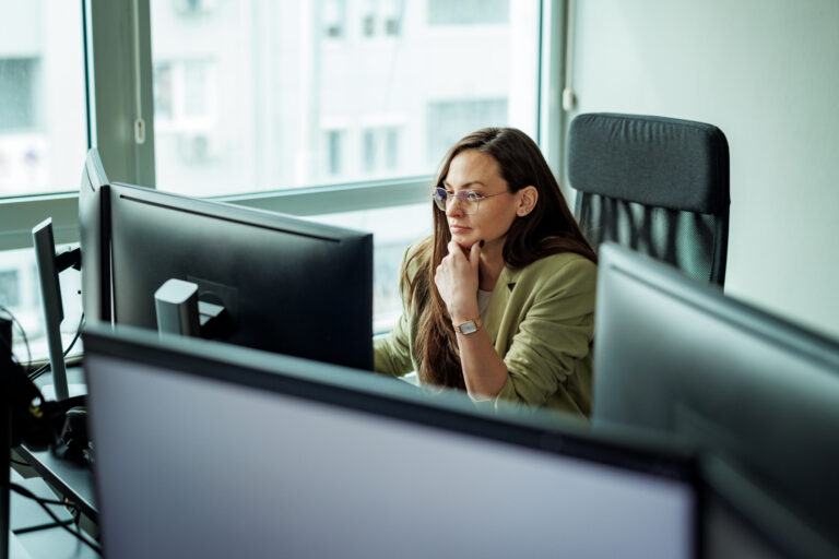 header image of lawyer working at desk in high back office chair