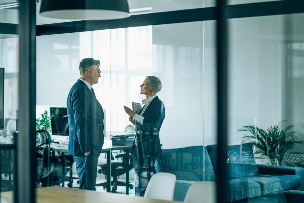 Litigation attorney reviewing expert witness reports and cost projections