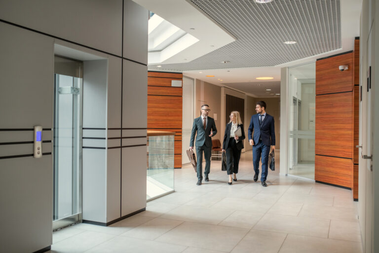 Business professionals walking around office