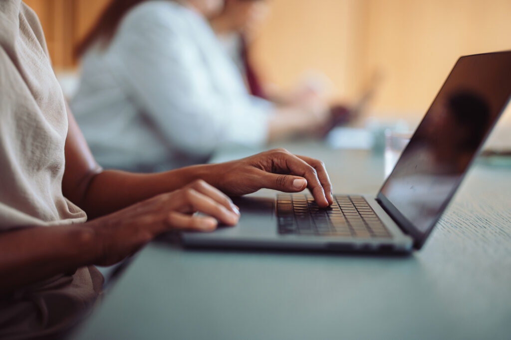 Person typing on computer