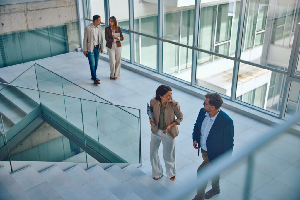 Group of business professionals on stairs in office