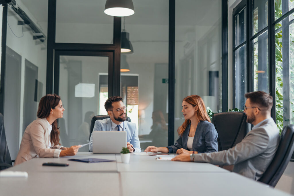 Four professionals in business setting
